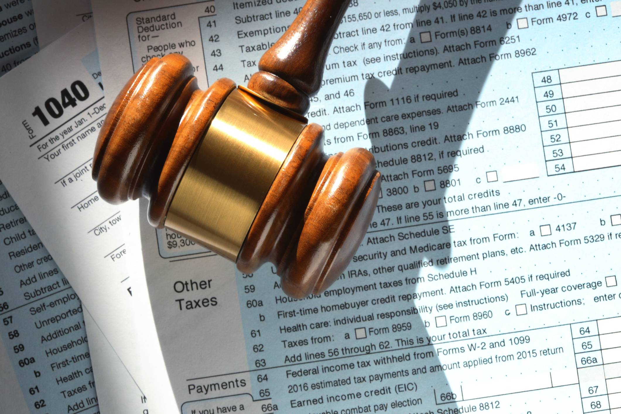 Gavel Resting On Top Of 1040 Tax Form